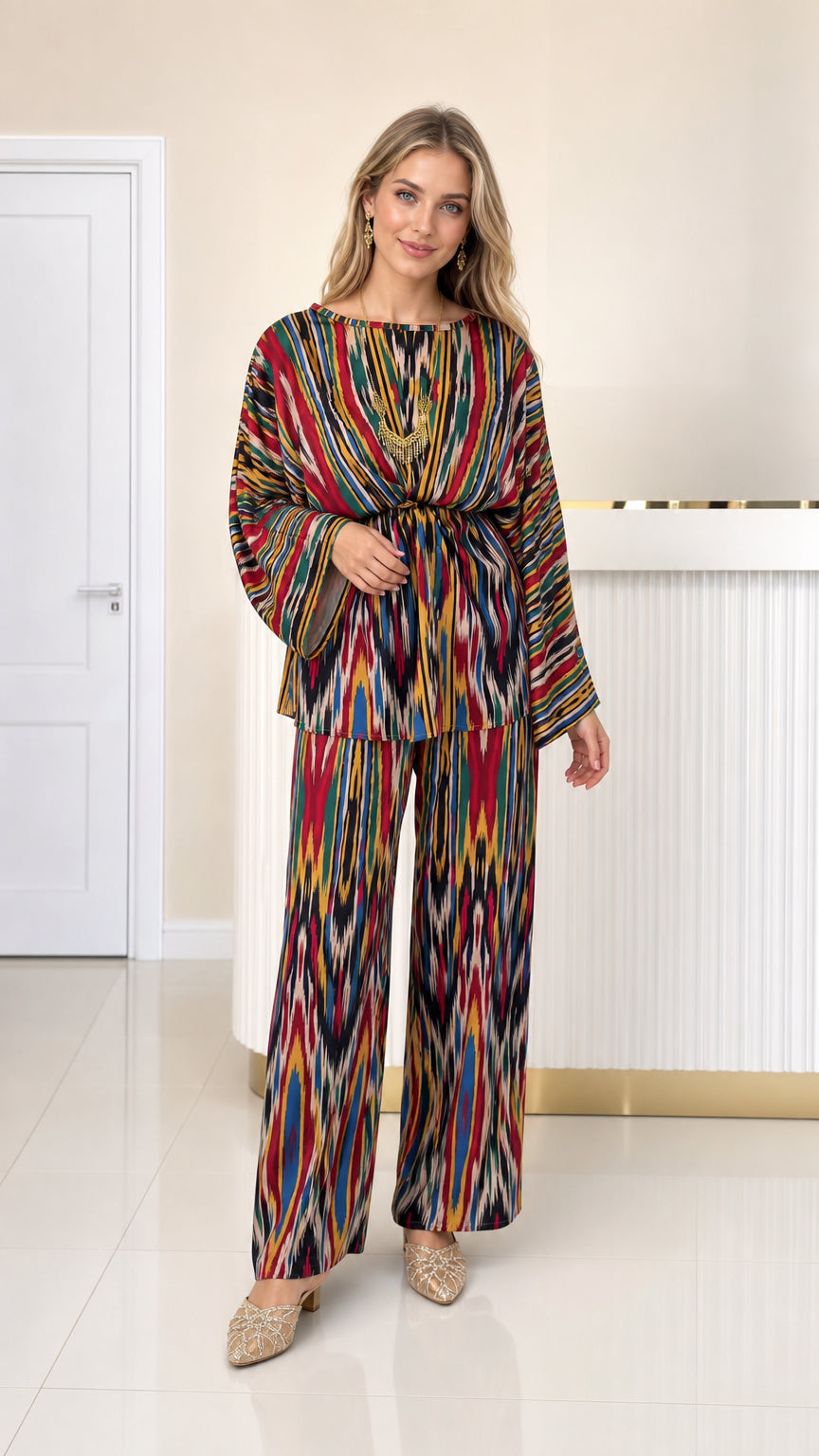 Front full view of woman wearing multicolor ikat print pleated top and wide leg pants set
