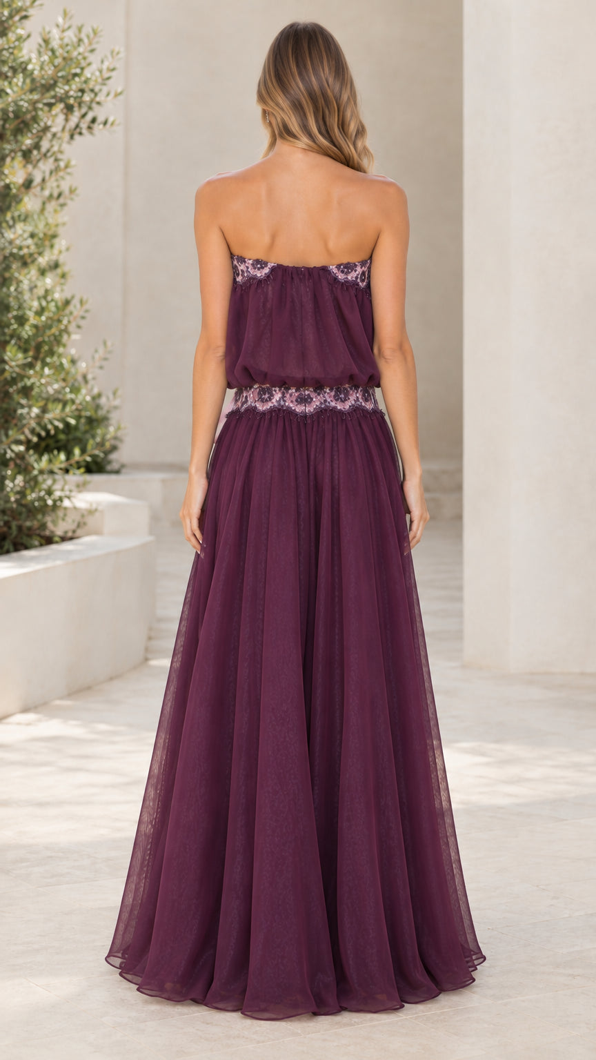 Model wearing Plum strapless maxi dress back view