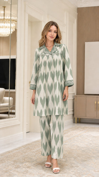 Front view of model wearing Sage Green embellished collar ikat print two-piece co-ord set