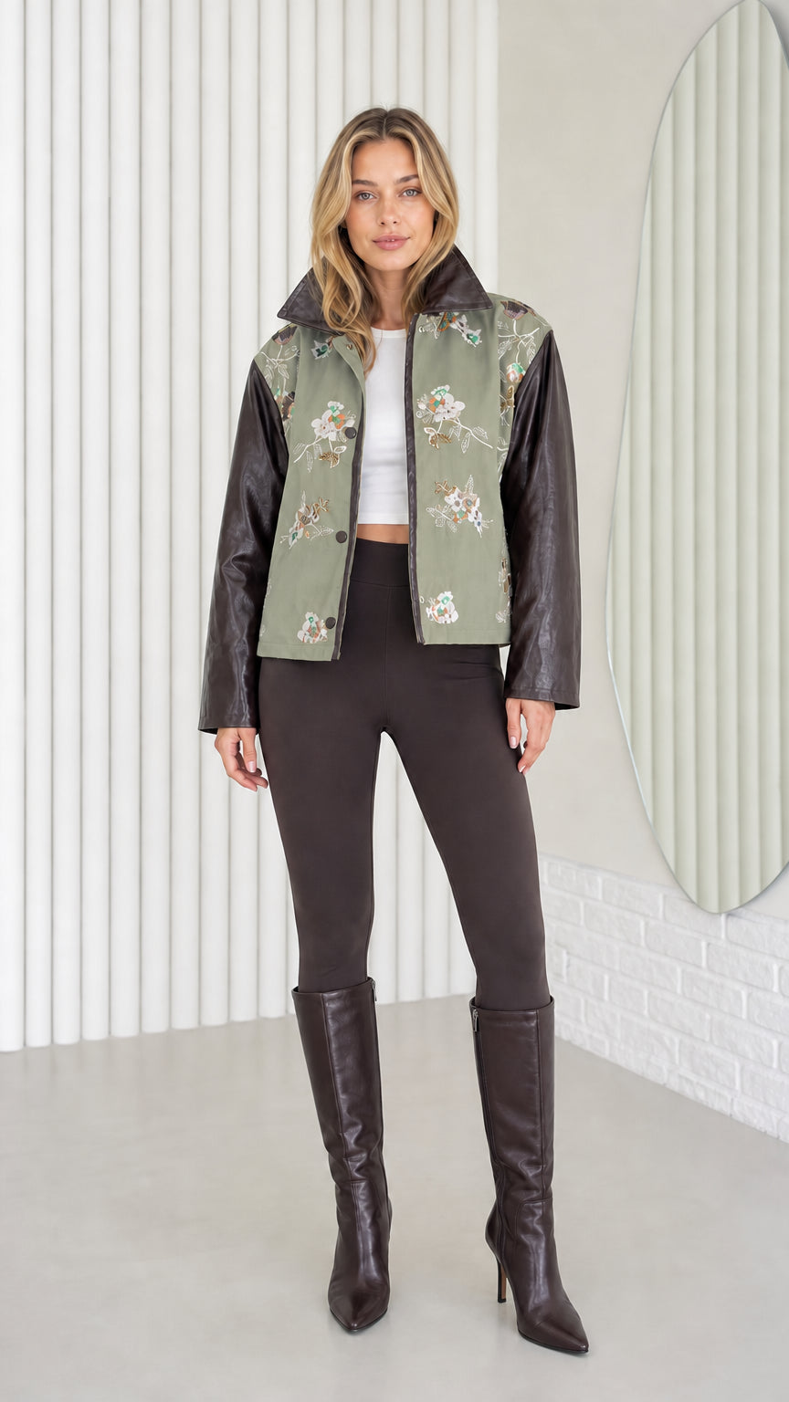 Model wearing Sage Green embroidered jacket with faux leather sleeves