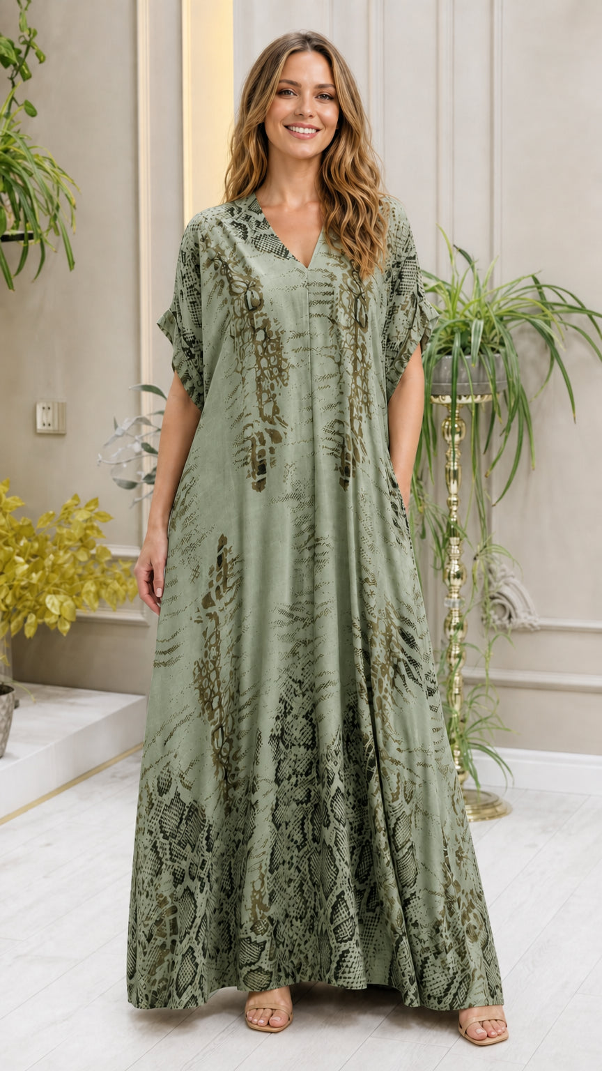 Model wearing sage green animal print kaftan dress